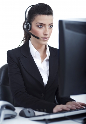 Beautiful Business Woman With Headset By Photostock